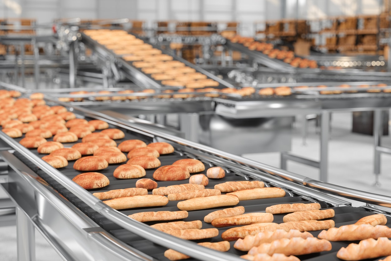 Close up View Of Conveyor Belt With Baked Breads