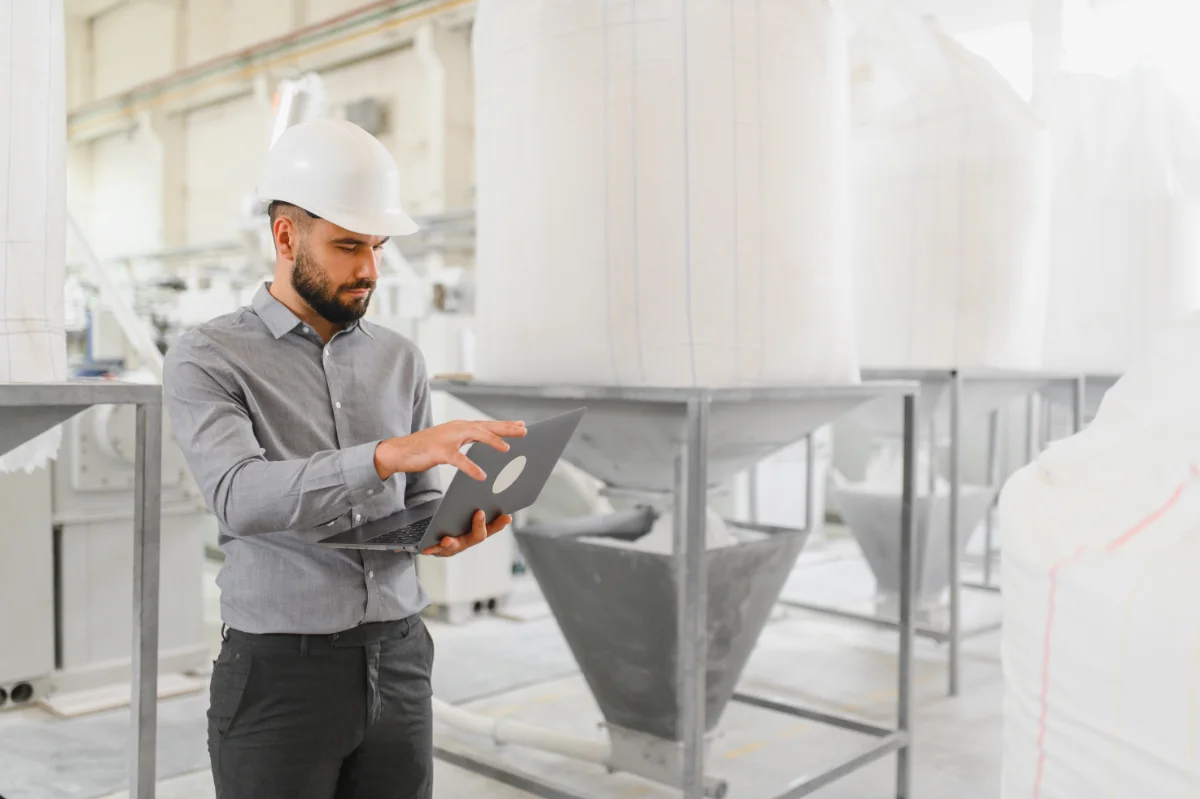 man assessing grain processing